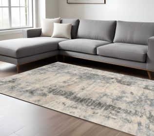 9' X 13' Ivory Blue Machine Woven Abstract Indoor Area Rug