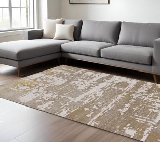 7' X 10' Ivory Gold Machine Woven Abstract Indoor Area Rug