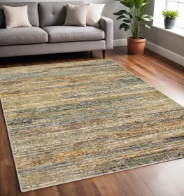 5' X 8' Gold And Green Abstract Area Rug