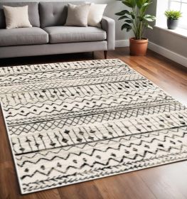 5' X 7' Ivory And Black Eclectic Patterns Indoor Area Rug